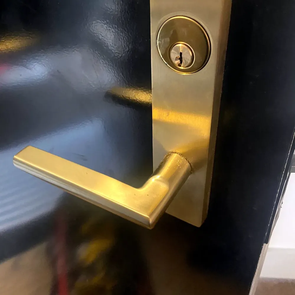 Brass commercial lever lock with a key cylinder