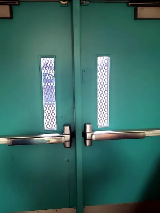 Double exit doors with panic bars