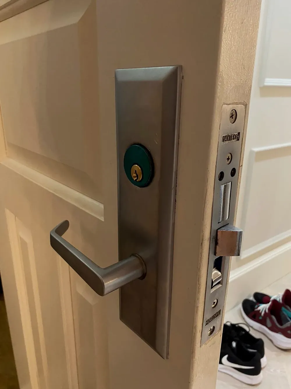 Commercial mortise lever lock on an office door