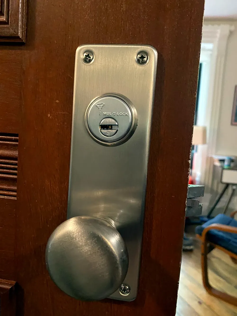 Satin mortise lock with a knob on an office door