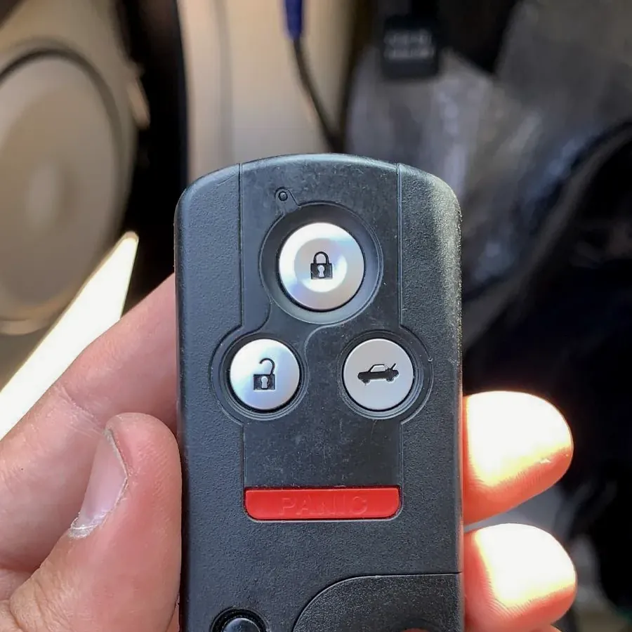 Acura remote key held in hand