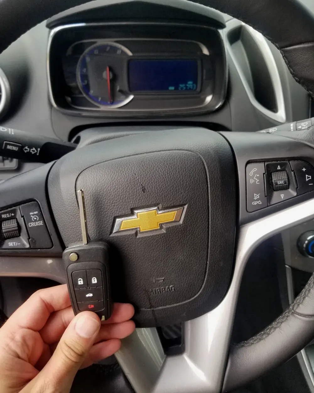 New Chevrolet flip key held at the steering wheel after a job in Hempstead, NY