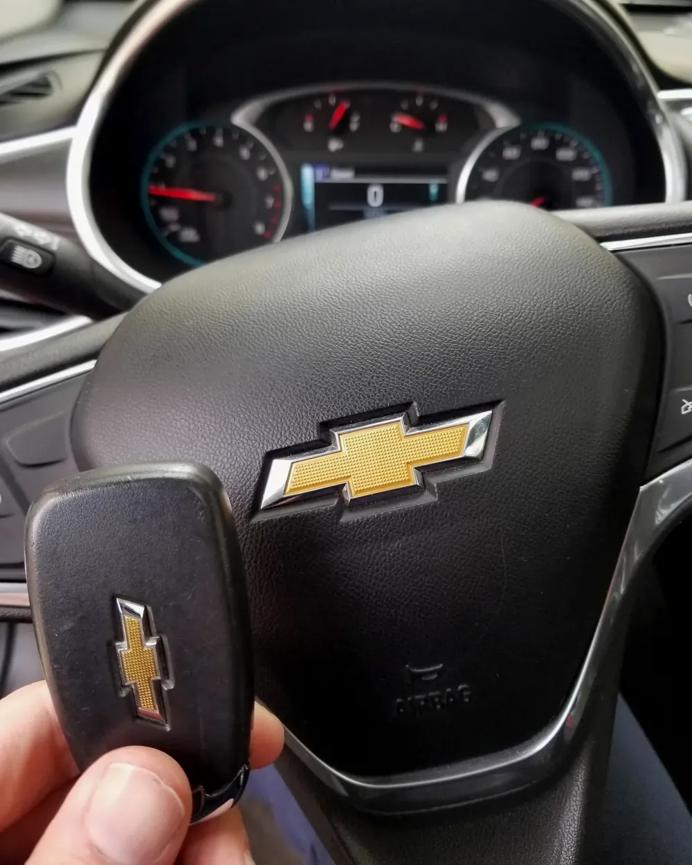 New Chevrolet smart key held at the steering wheel after a job in Inwood, NY