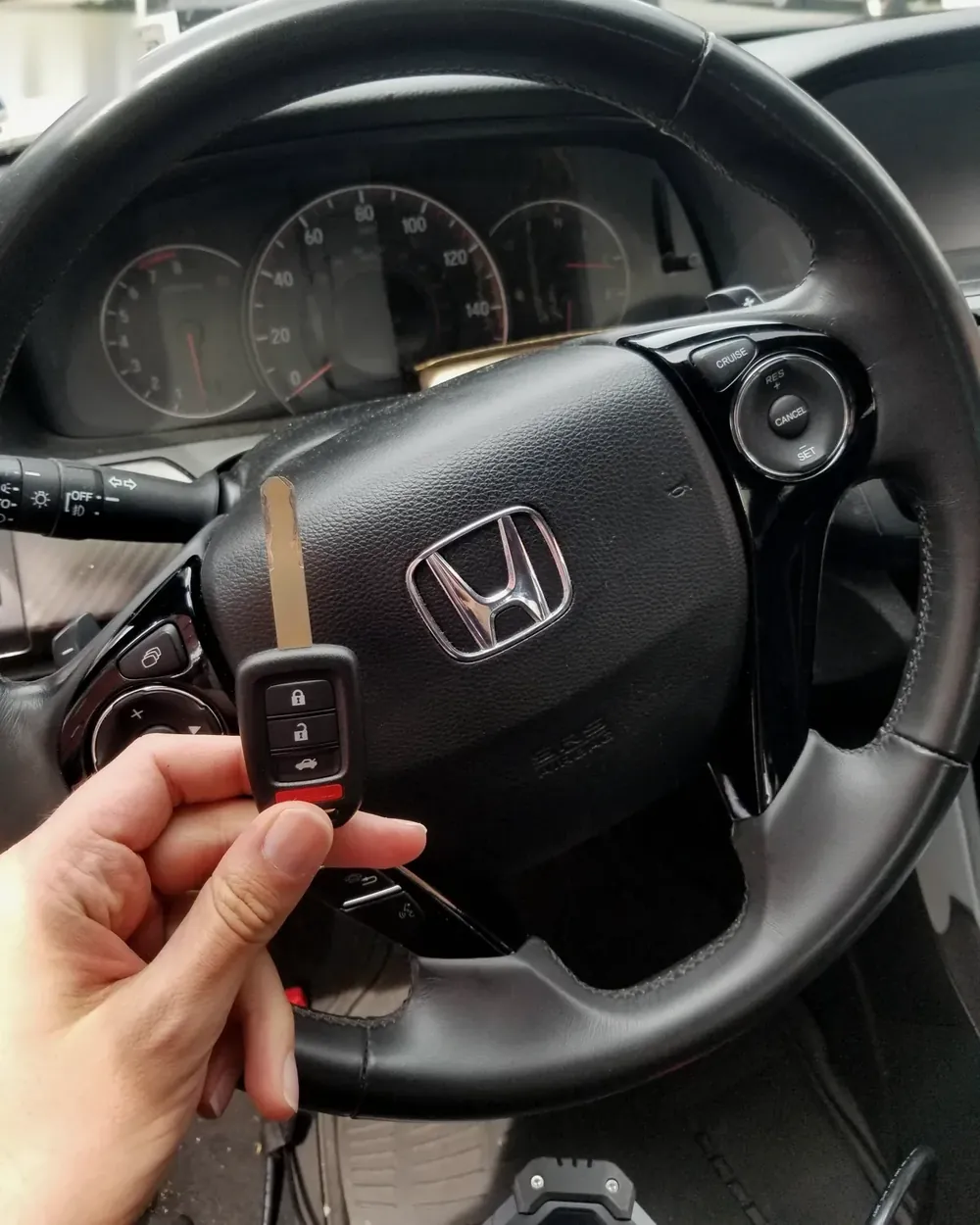 New Honda remote head key held at the steering wheel after a job in Woodmere, NY