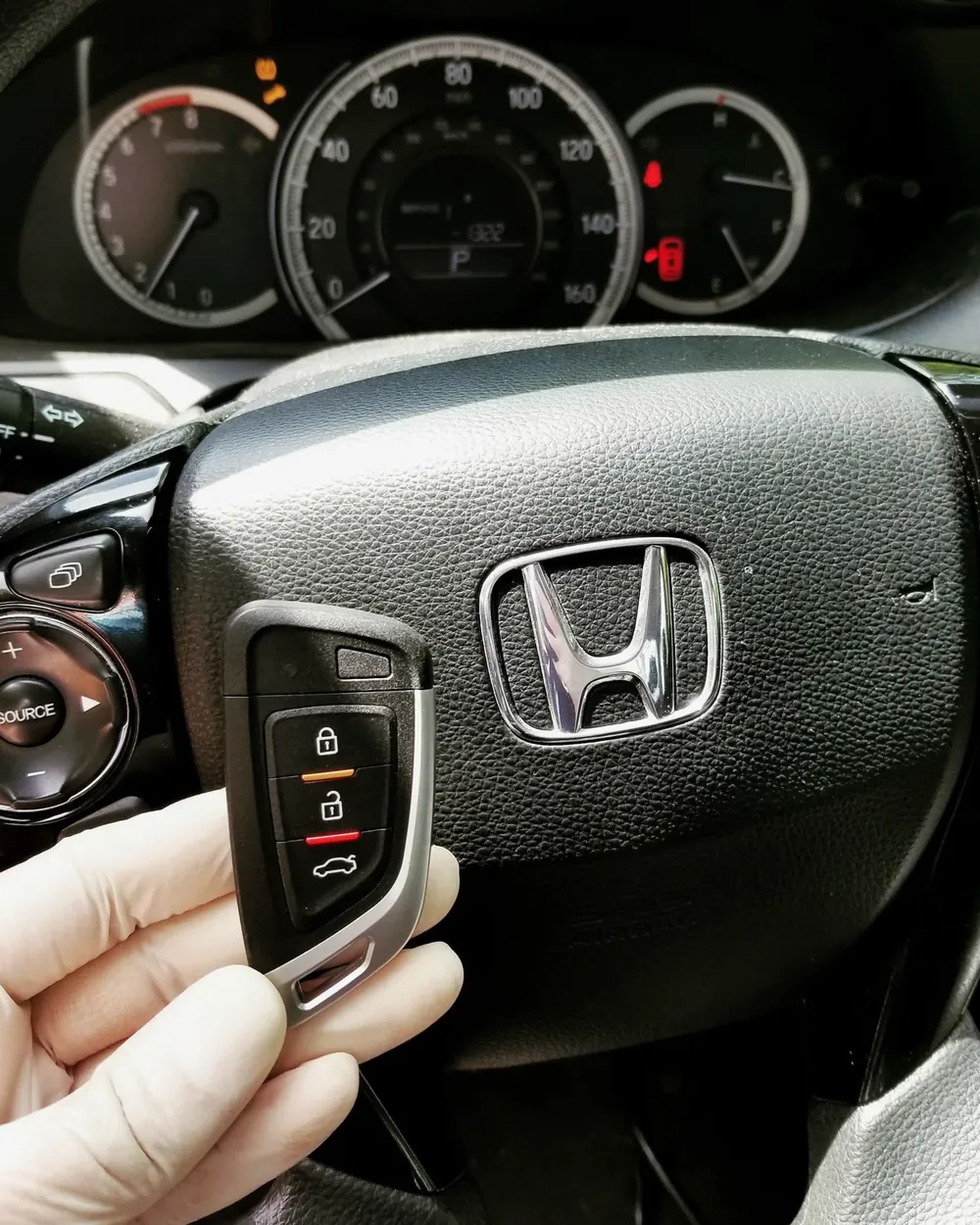 New Honda smart key held at the steering wheel after a job in Merrick, NY