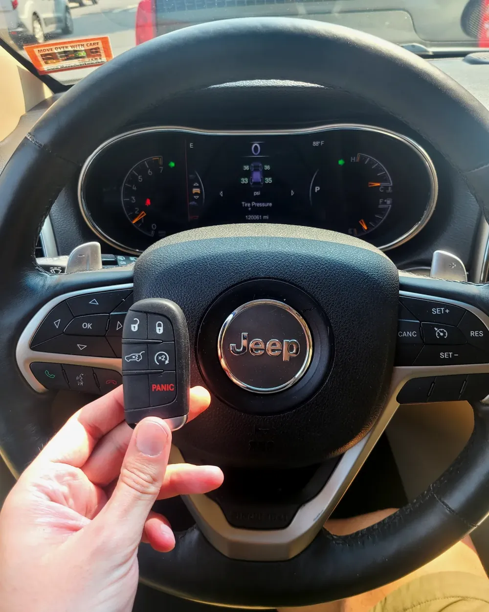 New Jeep smart key held at the steering wheel after a job in Baldwin, NY
