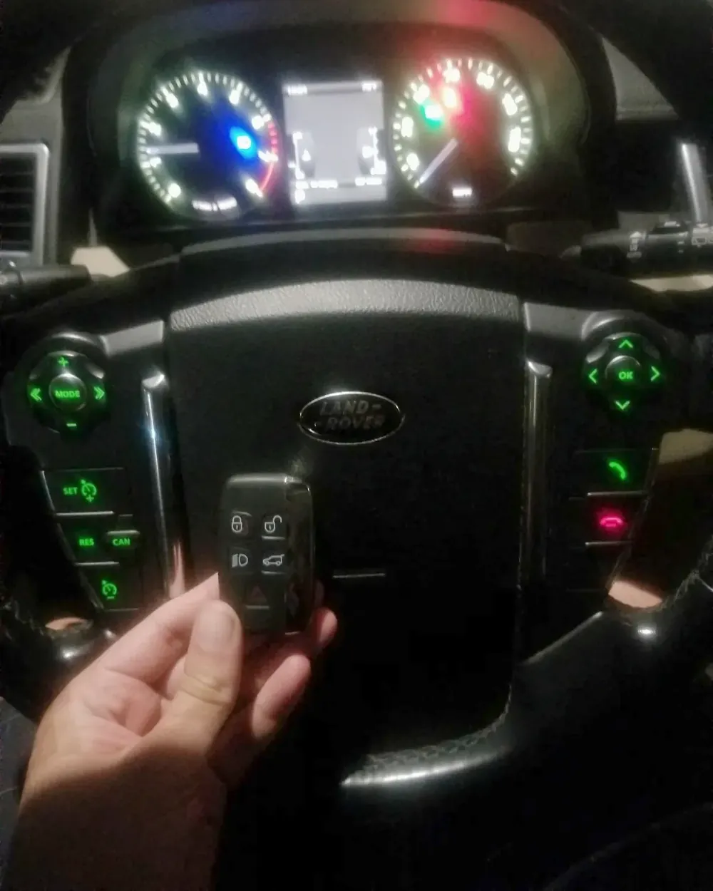New Land Rover smart key held at the steering wheel