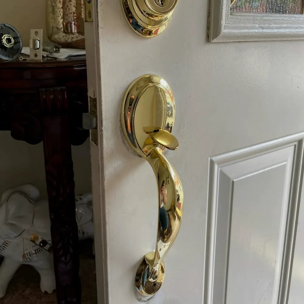 Brass handleset and deadbolt on a white front door