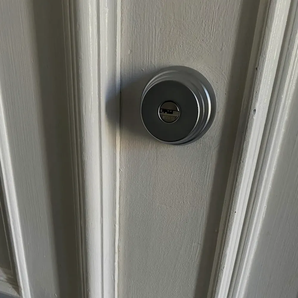 Deadbolt on a white front door