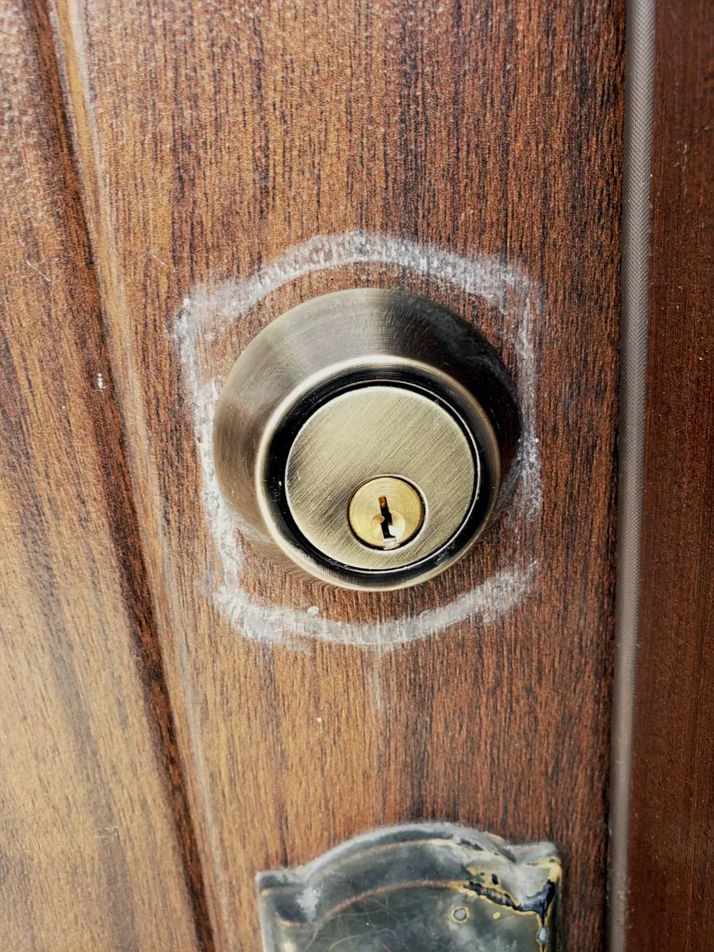 New deadbolt installed on a wood door